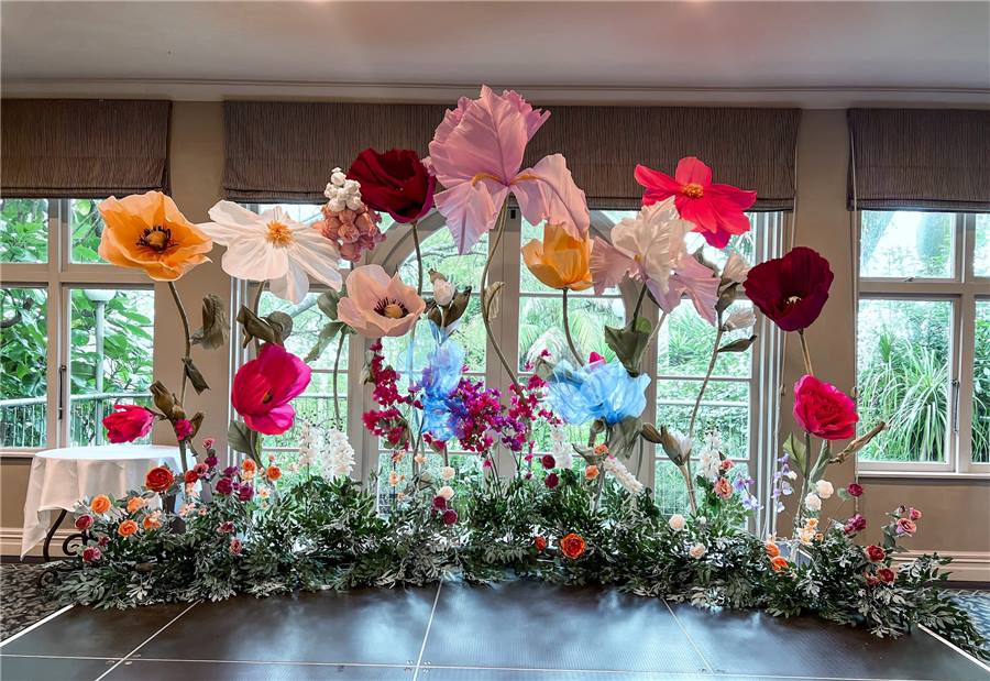 Bright giant flowers set with greenery